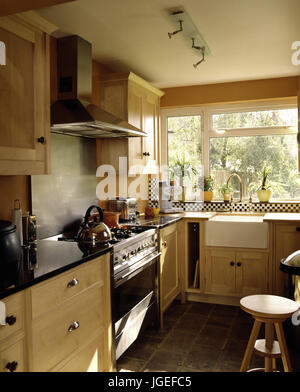 Cream kitchen with butlers sink and range oven Stock Photo