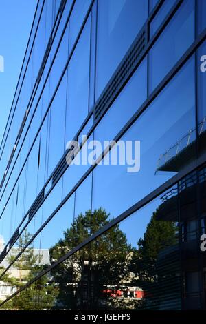 surrounding reflecting in a modern office building, glass facade with reflections Stock Photo