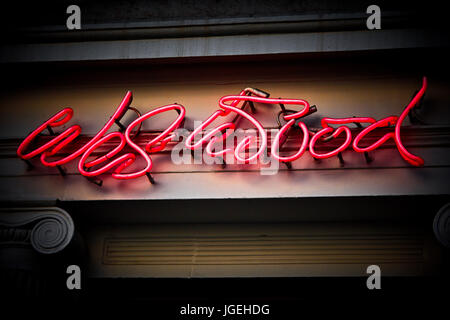 Neon sign above Vivienne Westwood's flagship store in Conduit Street in Mayfair, London Stock Photo