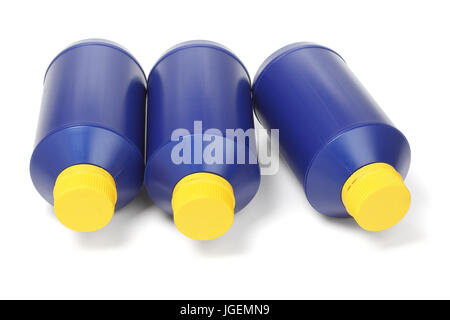 Three Blue Plastic Bottles Lying on White Background Stock Photo