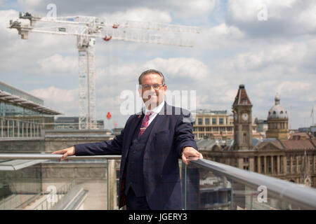 Birmingham City Council Leader Cllr John Clancy pictured in the garden of the Birmingham Library overlooking central Birmingham Stock Photo