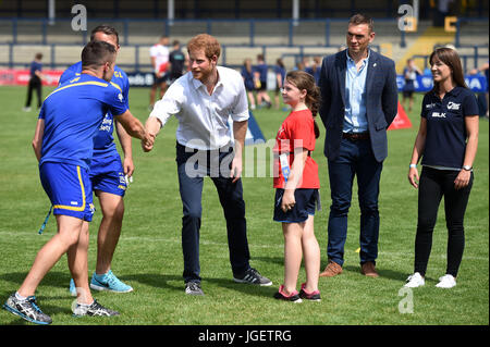 Prince Harry, accompanied by former Leeds Rhino Rugby league player, Kevin Sinfield, meets with children, coaches and players during his visit to the Headingley Carnegie Stadium in Leeds, on the first day of his two-day visit to the city. Stock Photo