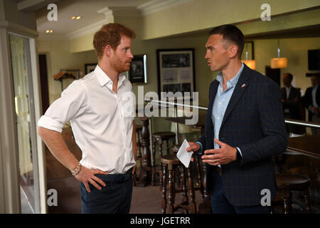 Prince Harry meets former Leeds Rhino rugby league player, Kevin Sinfield during his visit to the Headingley Carnegie Stadium in Leeds, on the first day of his two-day visit to the city. Stock Photo