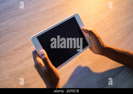 Male executive using digital tablet at his desk in office Stock Photo