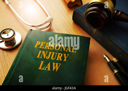 Personal injury law book on a table. Stock Photo