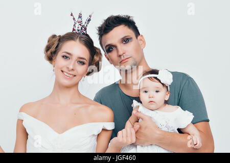 Happy family on a white background in white clothes Stock Photo