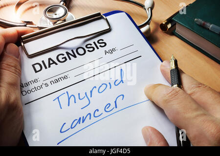 Diagnosis thyroid cancer in a medical form. Stock Photo