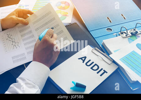 Document with title Audit on an office table. Stock Photo