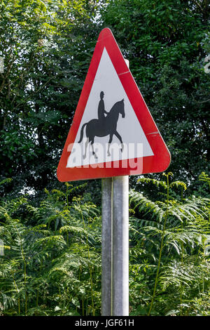 Triangular warning sign  - horses or equestrian stables nearby / using road. Country roadsigns UK. Stock Photo
