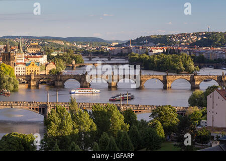 Buildings and bridges over Vltava River in Prague, Czech Republic, viewed slightly from above in the daytime. Stock Photo