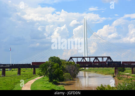 Storm clouds gather over the Margaret Hunt-Hill and Union Pacific RR bridges over the Trinity River just south and west of downtown Dallas Stock Photo