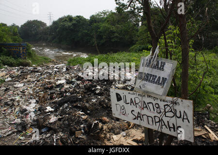 Scenery of a number of rivers in Bekasi, West Java contaminated with hazardous wastes on Thursday, July 6, 2017. Pollution of hazardous waste in a number of rivers is caused by the disposal of household wastes and industries without processing, whereas the rivers are one source of raw water For a drinking water company owned by the government of Bekasi. Until now the local government is still investigating the origin of the waste. (Photo byTubagus Aditya Irawan/Pacific Press) Stock Photo