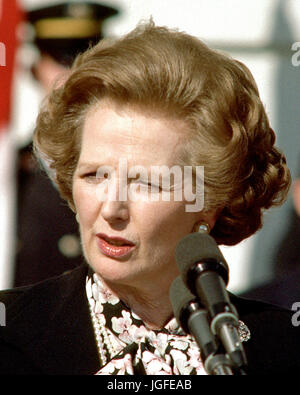 Washington, DC - (FILE) -- Prime Minister Margaret Thatcher of Great Britain, left, makes a statement following her 2 hour meeting with United States President Ronald Reagan (not pictured) outside the Diplomatic Entrance of the White House  in Washington, D.C. on Wednesday, February 20, 1985.  Mrs. Thatcher was in Washington for two days of talks with high administration officials..Credit: Arnie Sachs / CNP/ MediaPunch Stock Photo