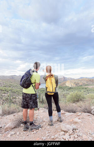 Couple admiring scenic view in desert Stock Photo