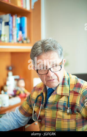 Portrait of serious Hispanic doctor Stock Photo