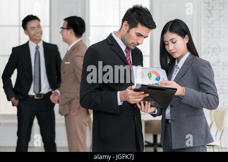 Group of muti Ethnicity business team meeting discussion in moddren office. Business team corporate organization meeting concept. Stock Photo