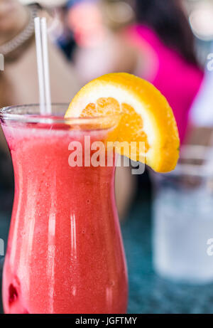 Macro closeup of iced strawberry daquiri in glass on table Stock Photo