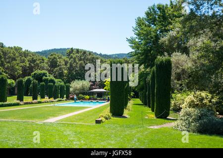 Swimming pool among formal gardens, added in 1945, at Filoli, a preserved country house, formal garden and estate operated by the National Trust for Historic Preservation in Woodside, California, June 23, 2017. Stock Photo