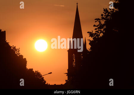 Berlin, Germany. 06th July, 2017. The sun sets next to the Gethsemane Church in the Prenzlauer Berg district of Berlin, Germany, 06 July 2017. Photo: Maurizio Gambarini/dpa/Alamy Live News Stock Photo