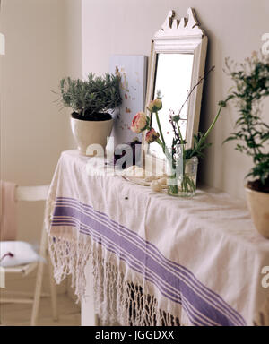 Dining room with painted floor and simple furniture Stock Photo