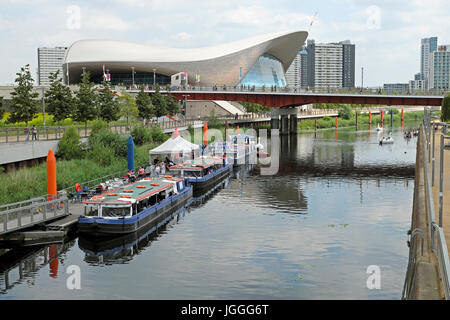 River Lea flowing through the Queen Elizabeth Olympic Park landscape and the Aquatics Centre Stratford, Newham East London England UK    KATHY DEWITT Stock Photo