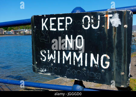 Keep out, no swimming danger sign  at Rothesay harbour, Scotland Stock Photo
