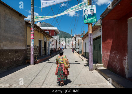 Woman walking on the street in the typical native dress ( Maya), Guatemala Stock Photo