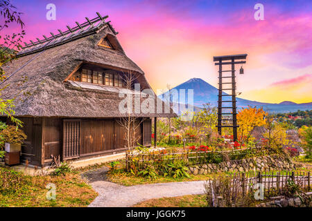 Mt. Fuji, Japan with historic village Iyashi no Sato during autumn Stock Photo