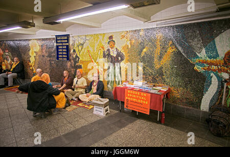 Hare Krishna devotees chanting and soliciting donations at the 34th Street subway station in Manhattan, New York City. Stock Photo