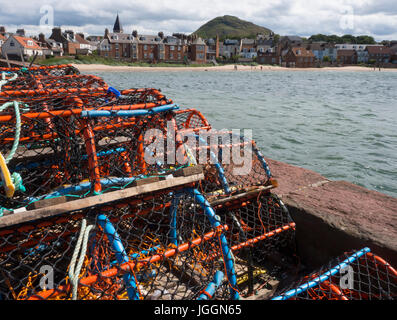stack of crab and lobster pots (creels) on the harbour at North Berwick, East Lothian, Scotland Stock Photo