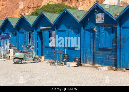 ALBUFEIRA, PORTUGAL - AUGUST 25, 2016: Typical small fishermen wooden houses in Olhos de Agua, Algarve, Portugal. Stock Photo