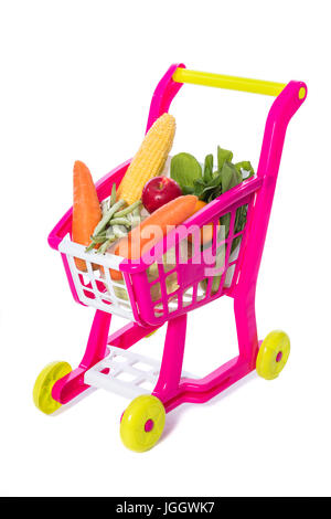 A toy trolley with vegetables in isolated white background. Stock Photo