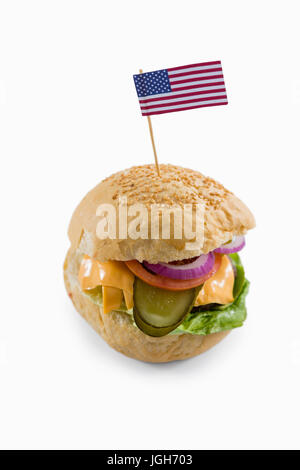 High angle view of cheeseburger with American flag on white background Stock Photo