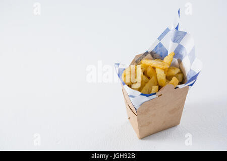 High angel view of French fries in carton box on table Stock Photo