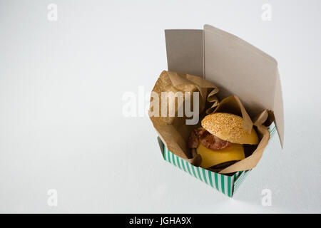 High angle view of burger with cheese and meat in box on table Stock Photo