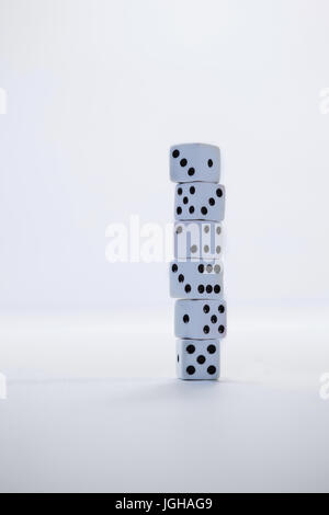 Stack of dices arranged on white background Stock Photo