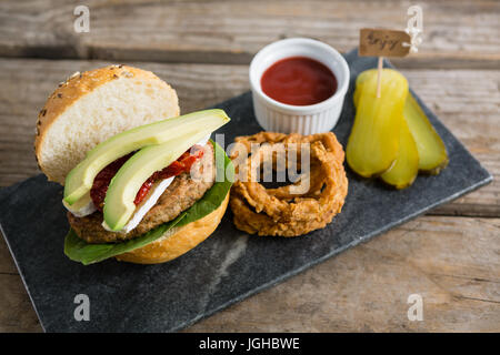 High angle view of food with burger on slate at table Stock Photo