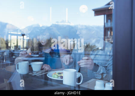 Couple having breakfast in the kitchen at home Stock Photo