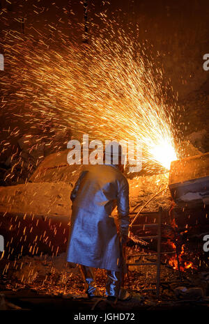 welder cut metal  in steel plant Stock Photo