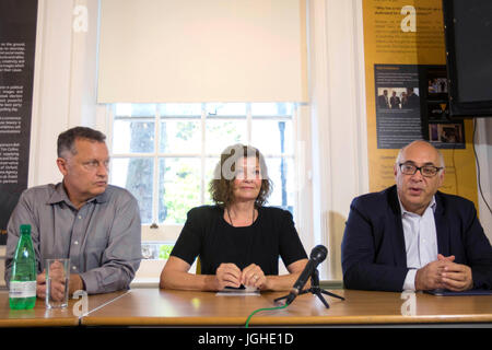 Moscow based lawyer Glenn Kolleeny (right) with stepfather Michael Calcutt (left) and mother Dana Madsen-Calcut (centre) of American student Colin Madsen, 25, who was found dead in a Siberian forest on April 4 2016, speak to the media as they call on Russian President Vladimir Putin to reopen the case. Stock Photo