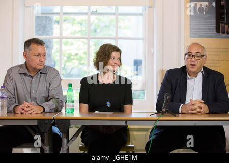 Moscow based lawyer Glenn Kolleeny (right) with stepfather Michael Calcutt (left) and mother Dana Madsen-Calcut (centre) of American student Colin Madsen, 25, who was found dead in a Siberian forest on April 4 2016, speak to the media as they call on Russian President Vladimir Putin to reopen the case. Stock Photo