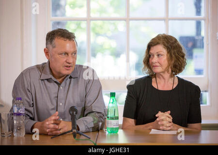 Stepfather Michael Calcutt (left) and mother Dana Madsen-Calcut of American student Colin Madsen, 25, who was found dead in a Siberian forest on April 4 2016, speak to the media as they call on Russian President Vladimir Putin to reopen the case. Stock Photo