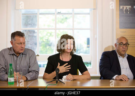 Moscow based lawyer Glenn Kolleeny (right) with stepfather Michael Calcutt (left) and mother Dana Madsen-Calcut (centre) of American student Colin Madsen, 25, who was found dead in a Siberian forest on April 4 2016, speak to the media as they call on Russian President Vladimir Putin to reopen the case. Stock Photo