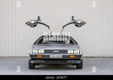 Adelaide, Australia - September 7, 2013: DeLorean DMC-12 car with opened doors parked on street near shed Stock Photo