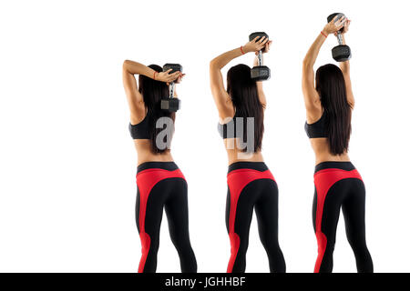 Example exercises with dumbbells, exercise on the triceps. Slim sportive brunette shows correct exercise performance with dumbbells in hand, left hand Stock Photo