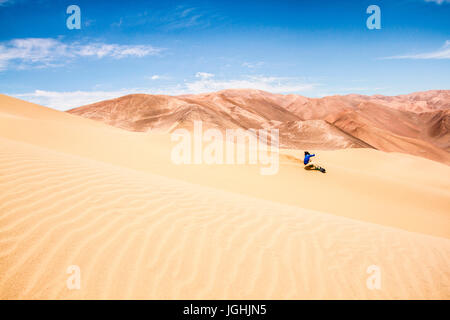 Sandboarding on Atacama Desert. Iquique, Tarapaca Region, Chile. 14.11.15 Stock Photo