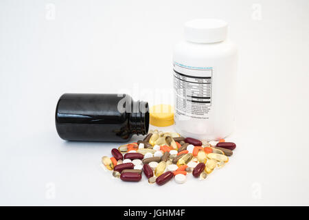 Variety of vitamins and pills with medicine bottles Stock Photo