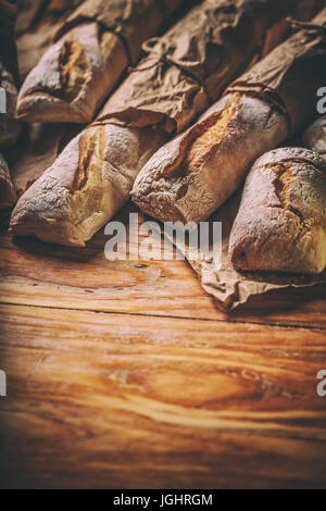 Different types of bread on wooden background Stock Photo
