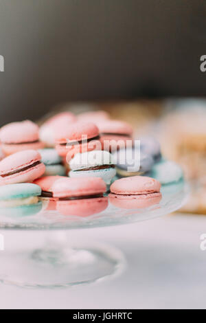 Close-up part view of the colourful macarons placed on the plate. Stock Photo