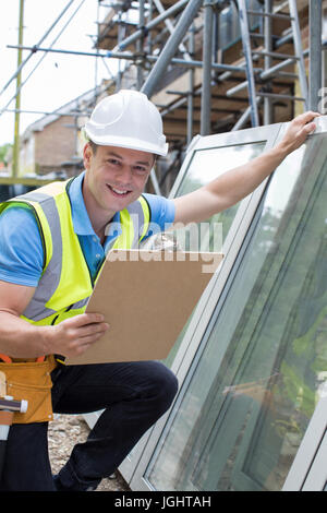 Portrait Of Construction Worker Preparing To Fit New Windows Stock Photo